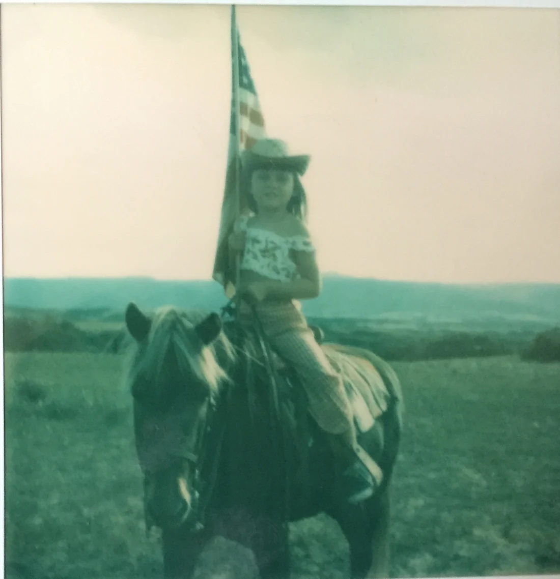 Candice as a young girl riding her pony
